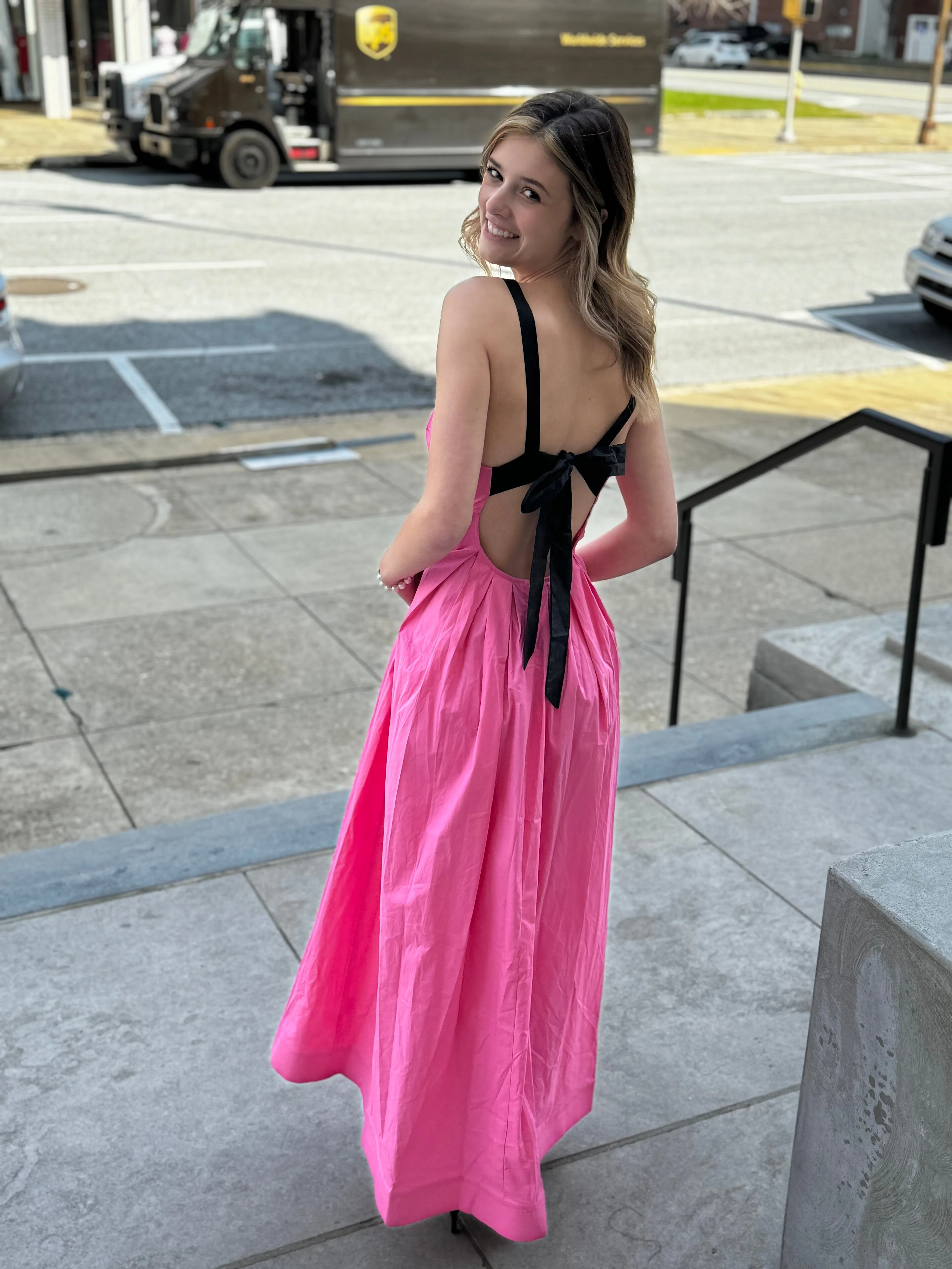 FABIOLA PINK PLEATED MAXI DRESS WITH BACK BLACK BOW/RIBBON