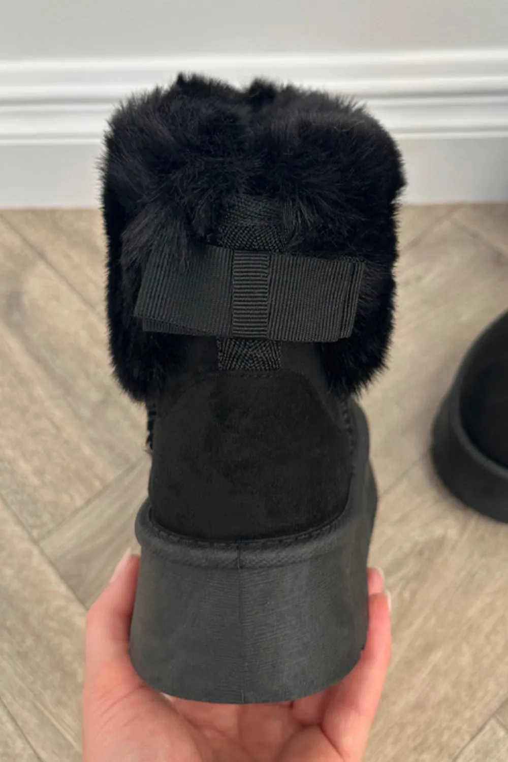 GLORIA SLIP ON ANKLE BOOTS WITH FAUX FUR AND BOW DETAIL IN BLACK SUEDE